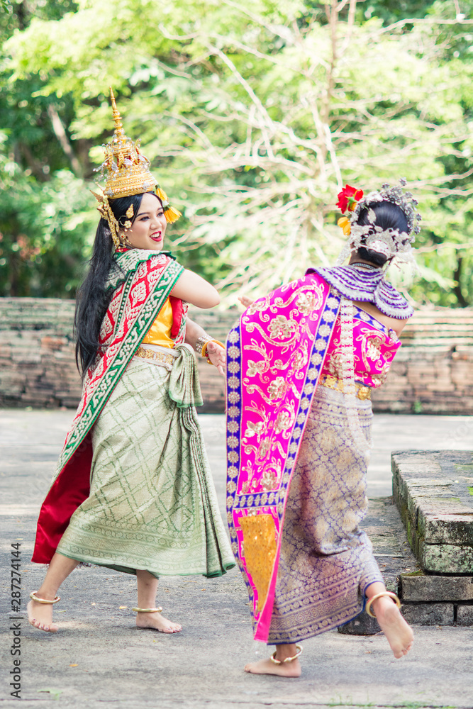 Naklejka premium Asian woman wearing typical, traditional Thai Dress. It is literally means 