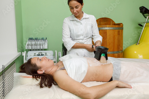 Cryolipolysis fat freezing treatment. Weight loss and slimming procedure photo