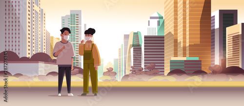 couple wearing face masks toxic gas air pollution industry smog polluted environment concept man woman walking outdoor dirty smoke skyscrapers cityscape skyline background full length horizontal