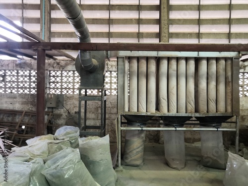 Wood dust filtration system from Wood Cutting Panel Saw Machine at the furniture factory.Dust collector in woodworking shop.