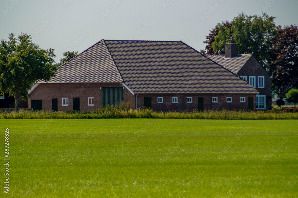 farmhouse with lawn and grass farmhouse with lawn and grass