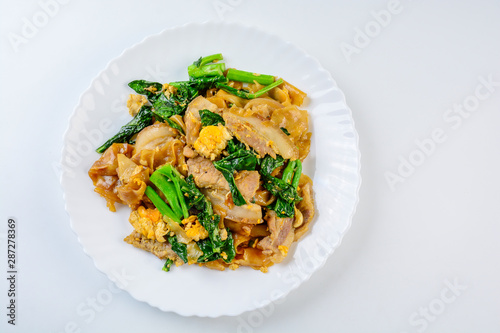 Stir-fried Fresh Rice-flour Noodles With Sliced Pork, Egg and Kale. Quick noodle stir-fry.