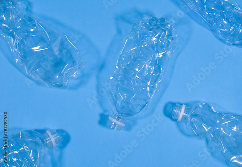 Plastic bottles isolated on blue background. Recycle waste management concept. Plastic Pet Bottles.