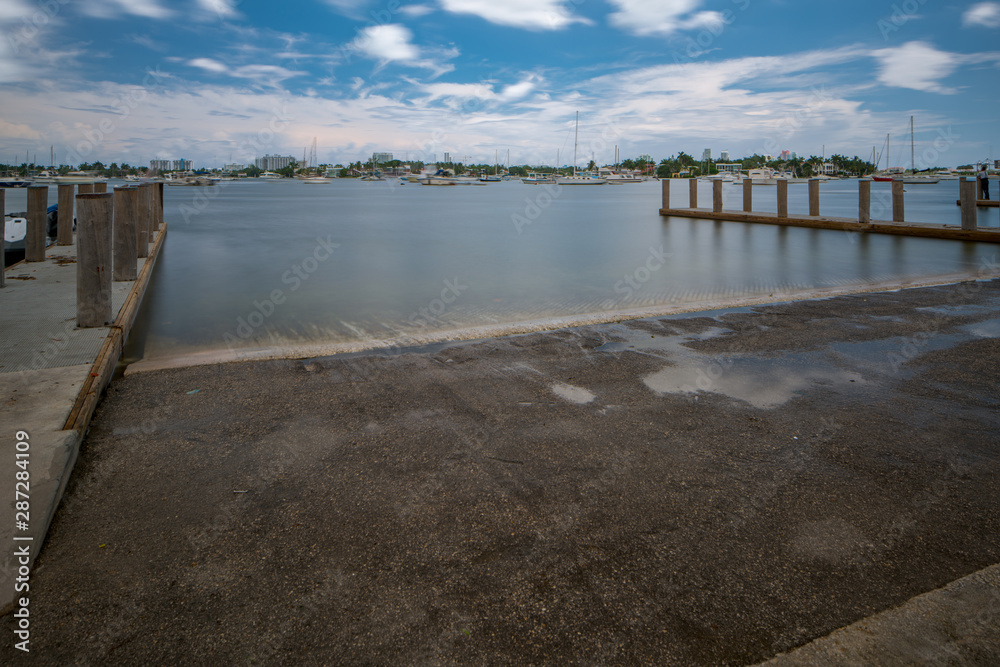 High tide at the docks. Long exposure shot for motion blur in sky clouds
