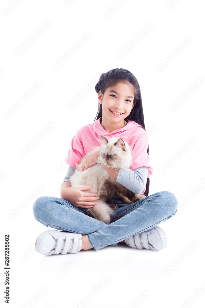 Pretty asian girl sitting on the floor and holding her cat with smiles over white background Pretty asian girl sitting on the floor and holding her cat with smiles over white background