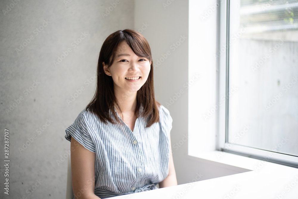 Young woman sitting on a chair 