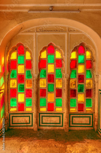 Coloured windows inside Hawa Mahal ("Palace of Winds" or "Palace of the Breeze") - a palace in Jaipur, India. © mukulbanerjee