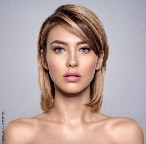 Front portrait of the woman with beauty face - isolated on white
