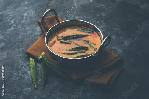 Hyderabadi Bhindi ka Salan or Okra salan made using ladies' fingers or ochro. Main course recipe from India. served in a bowl. selective focus