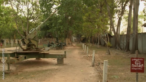 A daylight closeup shot of a Soviet 37mm anti-aircraft gun on display at the outdoor exhibit of the Cambodia War Museum in Siem Reap. photo