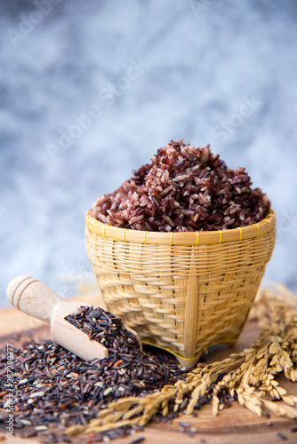 Jasmine rice, Brown rice in wicker basket with wooden spoon, yellow paddy rice, Coarse grain and coarse grain farmer organic black rice, Selective focus.