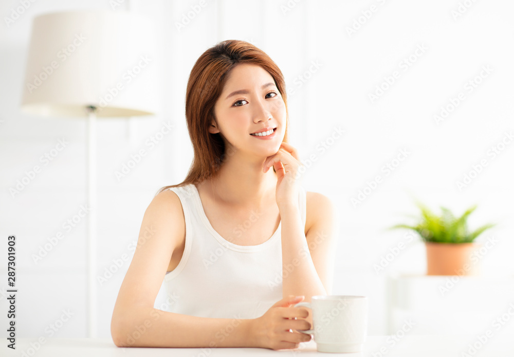 closeup smiling young asian woman in living room