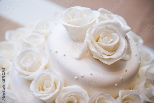 top of the cake, decorated with edible roses