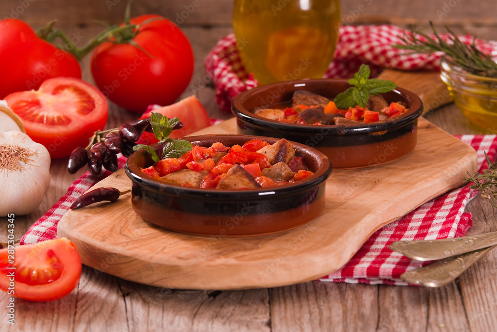 Marinated pork loin in tomato sauce. Marinated pork loin in tomato sauce.