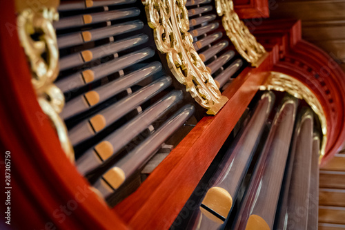 Beautiful detail of a wind organ as a religious musical instrument