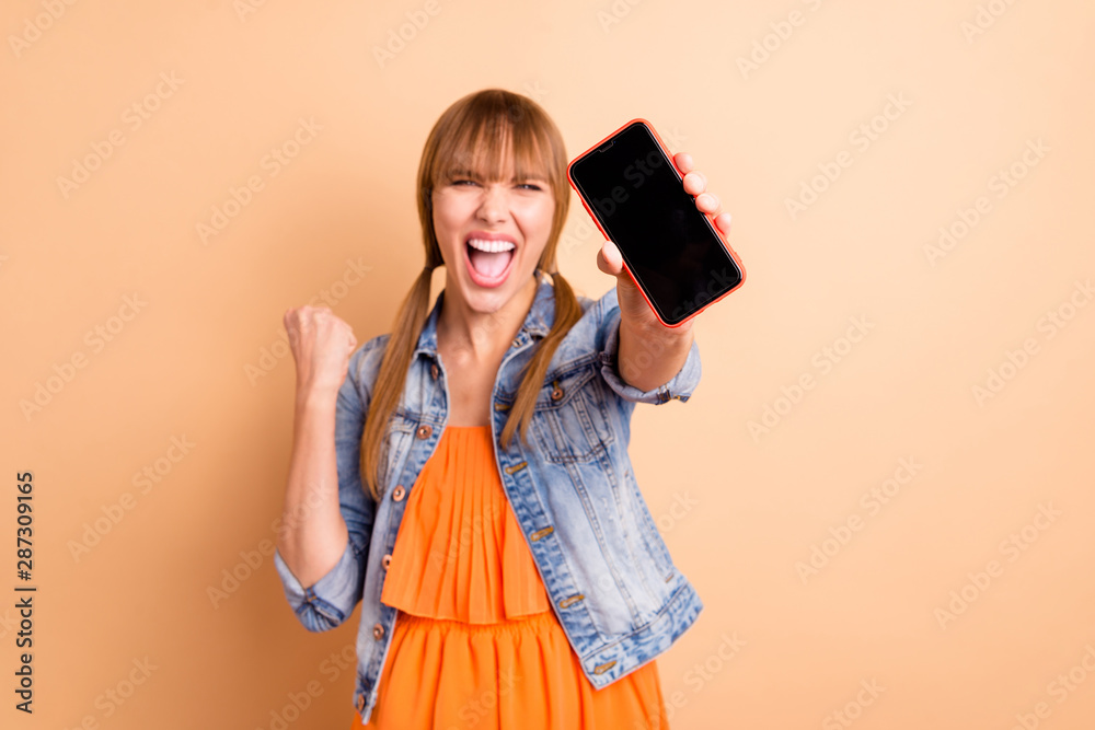 Crazy lady with telephone in hands advising buy for low price wear casual outfit isolated beige background Crazy lady with telephone in hands advising buy for low price wear casual outfit isolated beige background