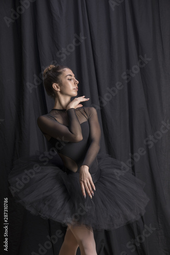 Medium shot ballerina with hand under chin