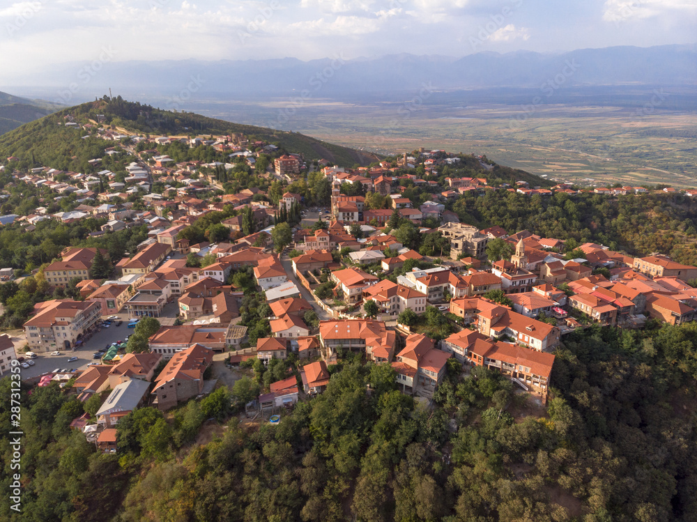 Fototapeta premium red roof in the city love above drone