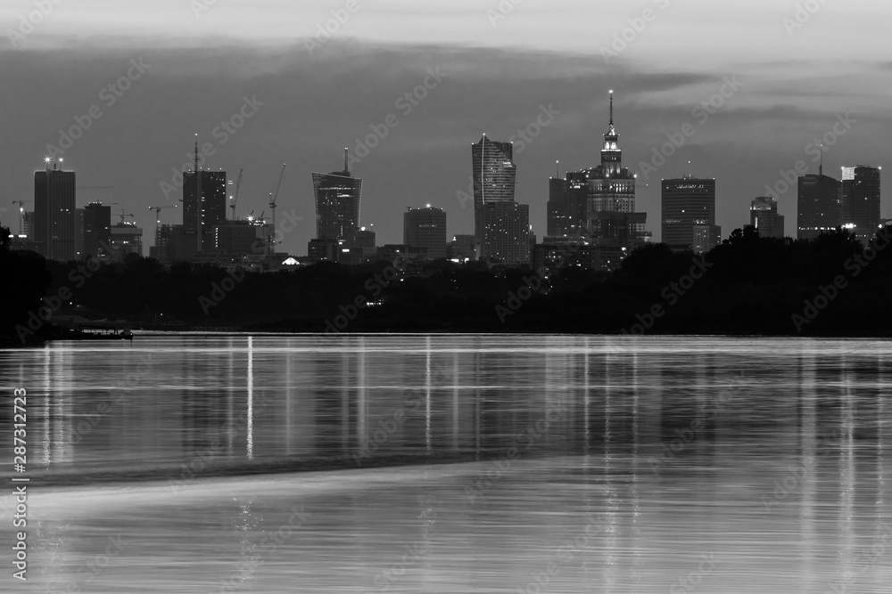 Fototapeta premium Warsae skyline with skyscrapers in the downtown. Their reflection in the Vistula River.