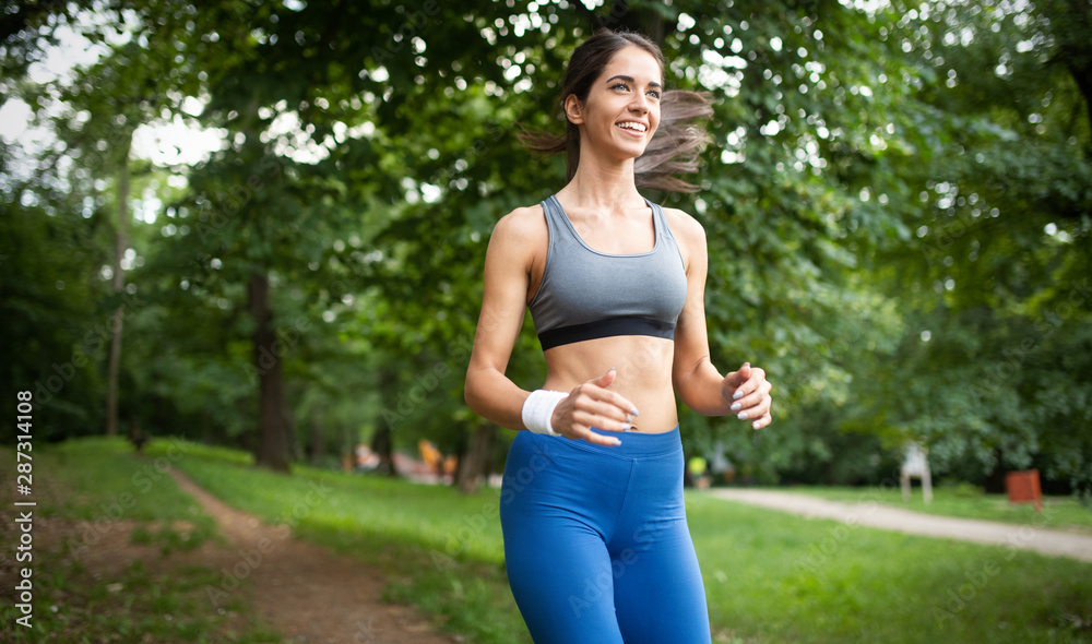 Portrait of athletic woman resting after running in nature Portrait of athletic woman resting after running in nature