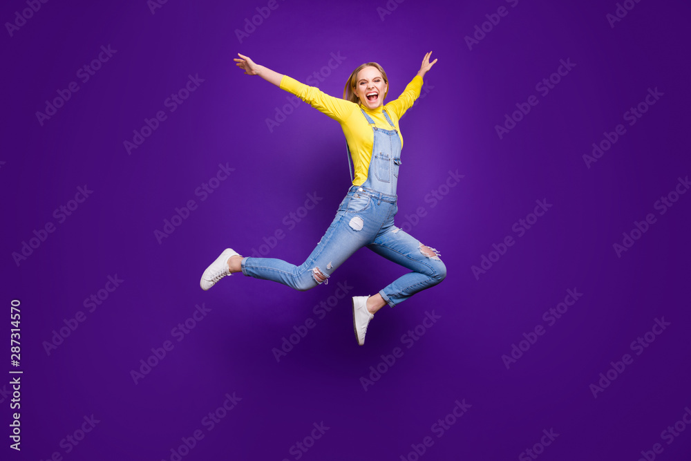 Full size photo of lovely youth raising her hands screaming isolated over purple violet background