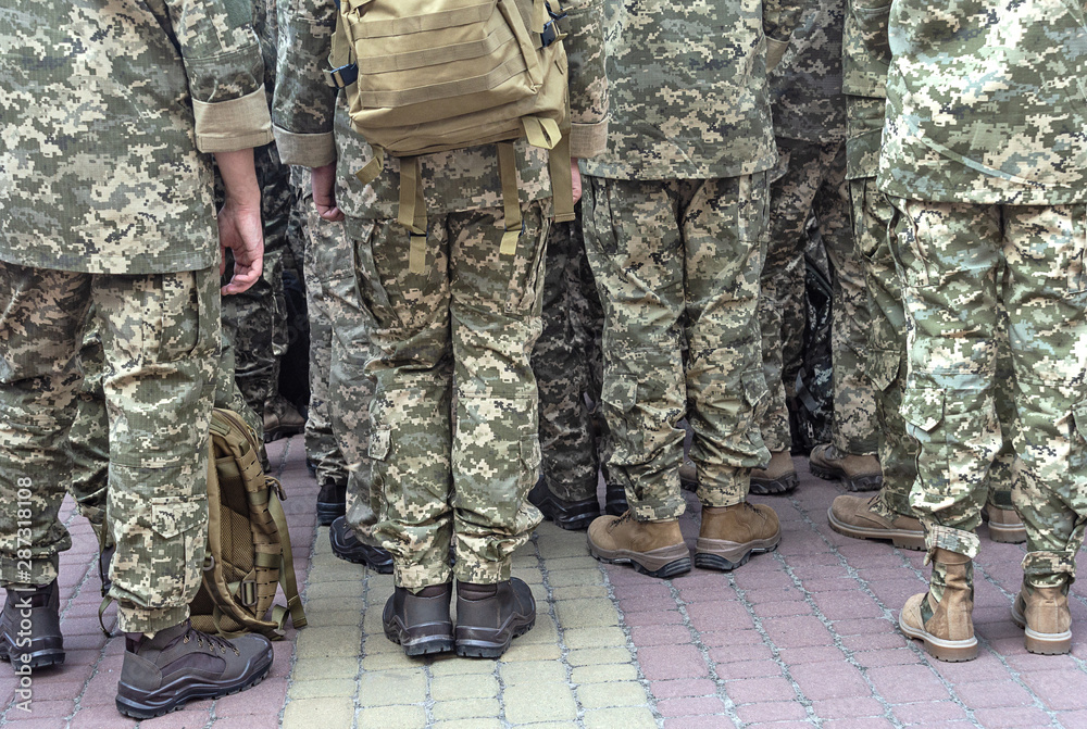 Soldiers in pixel camouflage uniforms Soldiers in pixel camouflage uniforms