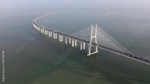 Aerial: Cars Traveling Over the Tagus River on the Vasco da Gama Bridge - Lisbon, Portugal