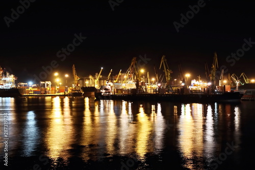 Sunset in the port of Odessa. Night views of piers and ships. Summer 2019.