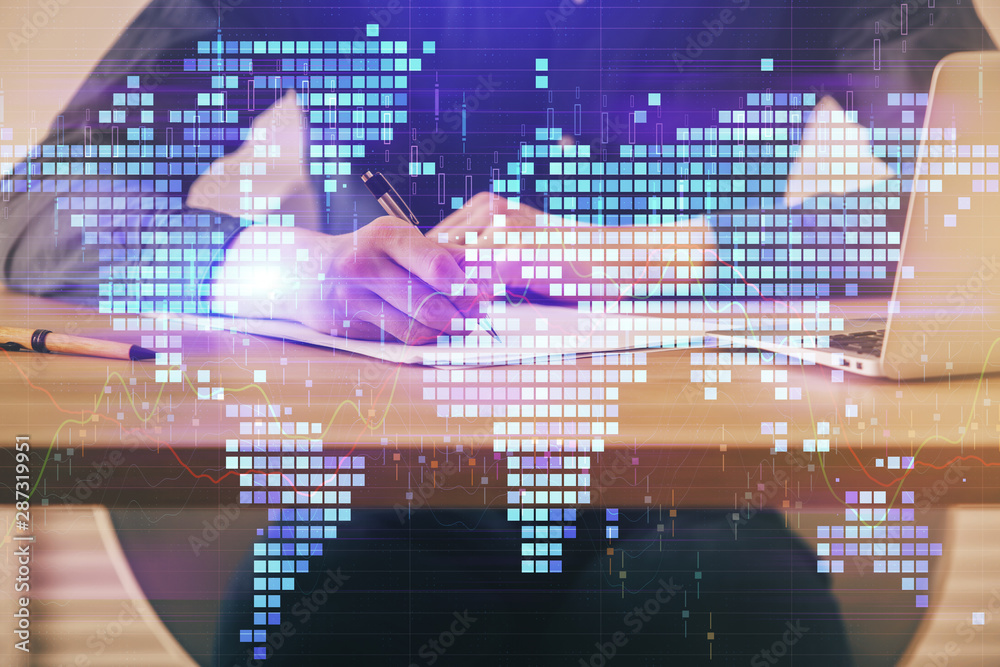 Double exposure of hands and notepad with business icons. Double exposure of hands and notepad with business icons.