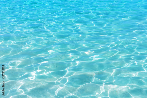 Shining blue water ripple background. © preto_perola