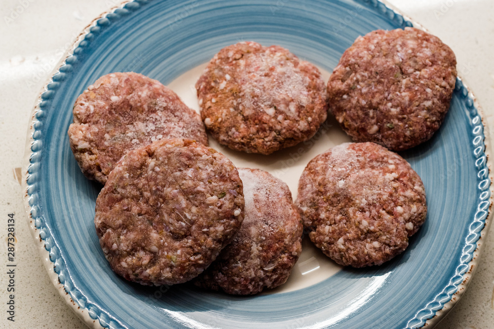 Turkish Raw Meatballs Kofte or Kofta made with Minced Meat in Plate. Turkish Raw Meatballs Kofte or Kofta made with Minced Meat in Plate.
