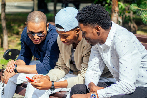 Bild auf Leinwand a group of three fashionable well-dressed cool African American guys students co