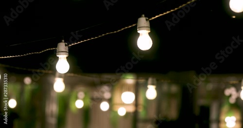 outdoor party string lights glowing at night