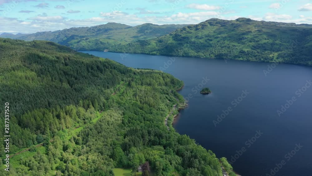 Aerial view of Loch Lomond, picturesque scene with lake and lush green hills - landscape panorama of Loch Lomond & The Trossachs National Park from above, Scotland, United Kingdom,Great Britain,Europe Aerial view of Loch Lomond, picturesque scene with lake and lush green hills - landscape panorama of Loch Lomond & The Trossachs National Park from above, Scotland, United Kingdom,Great Britain,Europe