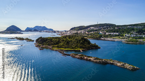 Countryside road to the sea in summer in Alnes, godoy island, Norway. Aerial shot from drone of norway landscape photo