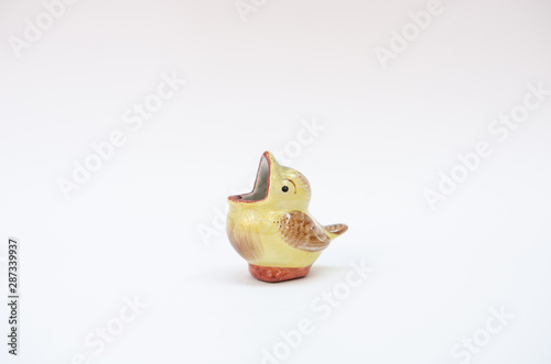 Vintage ceramic bird figurine - little hungry bird opens its beak wide - midcentury mass production object from Europe