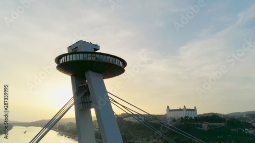 Amazing Aerial View of Bratislava (Slovakia): European Old Town, Castle and Most SNP (Ufo Car Road Bridge) across Danube River at Summer Sunset