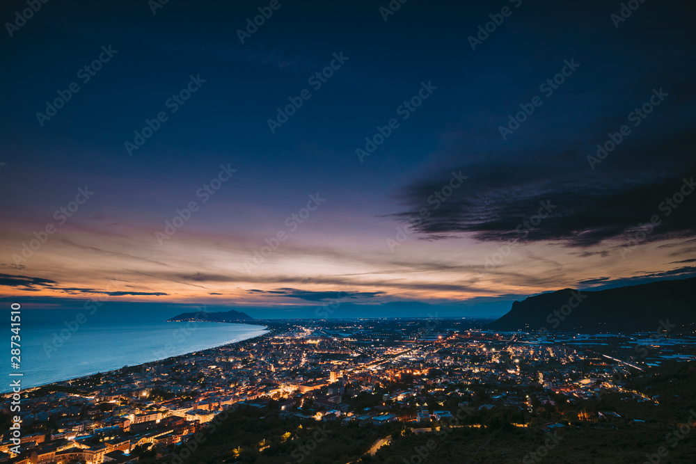 Terracina, Italy. Top View Skyline Cityscape City In Evening Night Illuminations