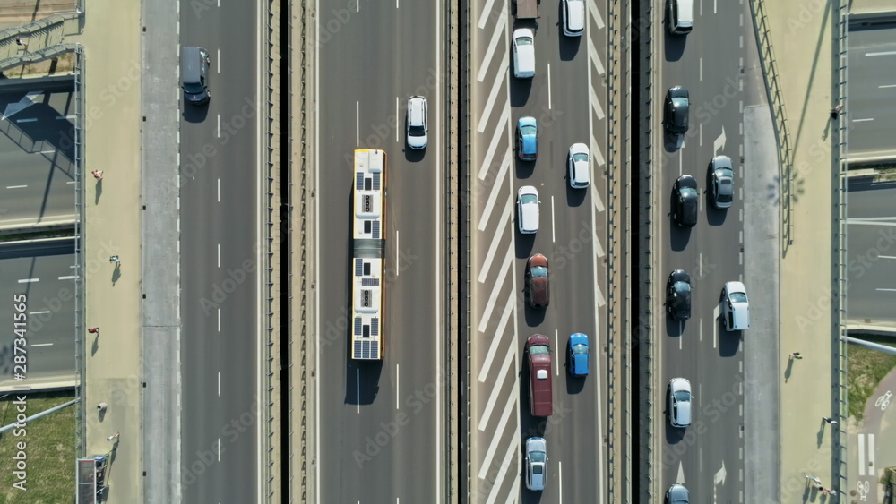 Transportation and Infrastructure: Highway Interchange and Junction with Cars, Trucks and Buses. Aerial View of Road Traffic Jam at Daytime Rush hour in Warsaw, Poland
