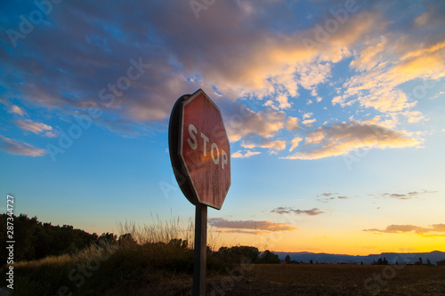 Señal de stop al atardecer photo