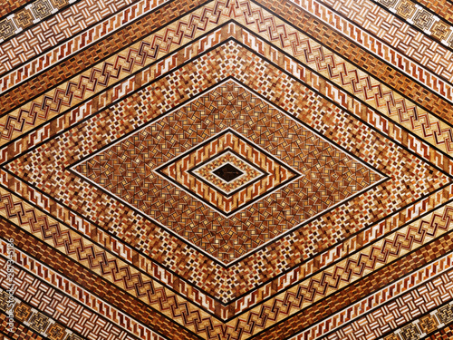 Abstract and geometric mosaic marquetry wooden surface. Diamond shape pattern. photo