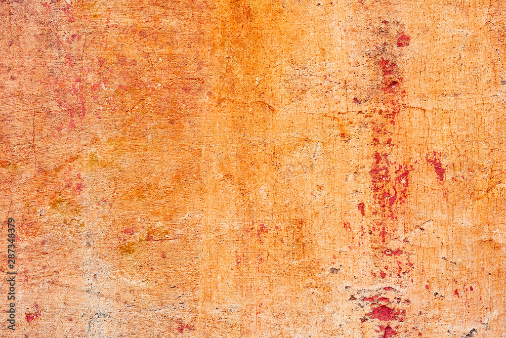 Texture of a concrete wall with cracks and scratches which can be used as a background