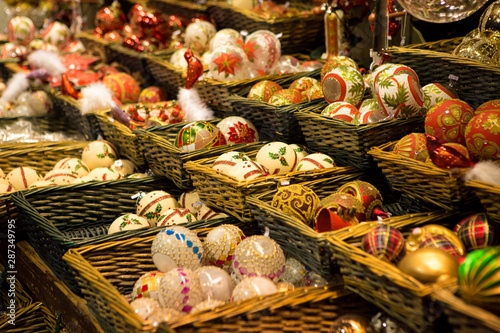 Christmas souvenirs on the counter in Europe, Painted glass Christmas balls with fairy tales.