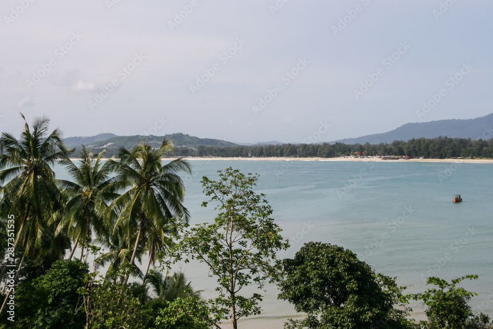 2011.05.07, Phuket, Thailand. Travel around Asia. Seascape with palm trees and horizon line on Phuket Island.