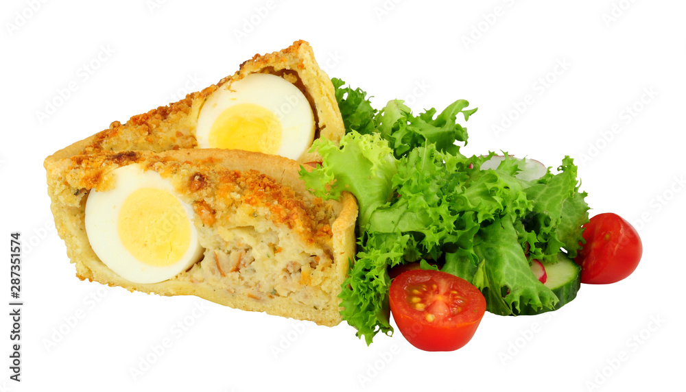 Scotch egg quiche with shortcrust pastry and whole egg encased in pork sausage meat with fresh salad isolated on a white background Scotch egg quiche with shortcrust pastry and whole egg encased in pork sausage meat with fresh salad isolated on a white background