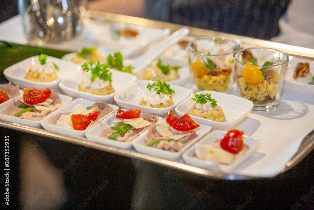 Tasty and colorful appetizers being served on a plate on a party