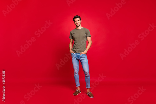 Tableau sur toile Full length photo of macho guy hold hands pockets street look wear casual outfit