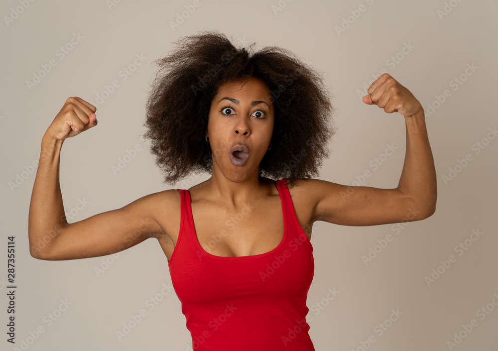 Close up portrait of funny strong smiling and laughing attractive african american woman Close up portrait of funny strong smiling and laughing attractive african american woman