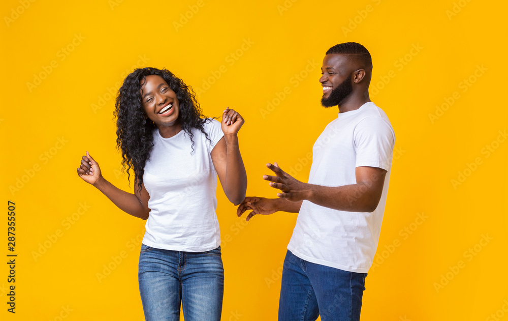 Lovely afro couple having good time with each other - obrazy, fototapety, plakaty 