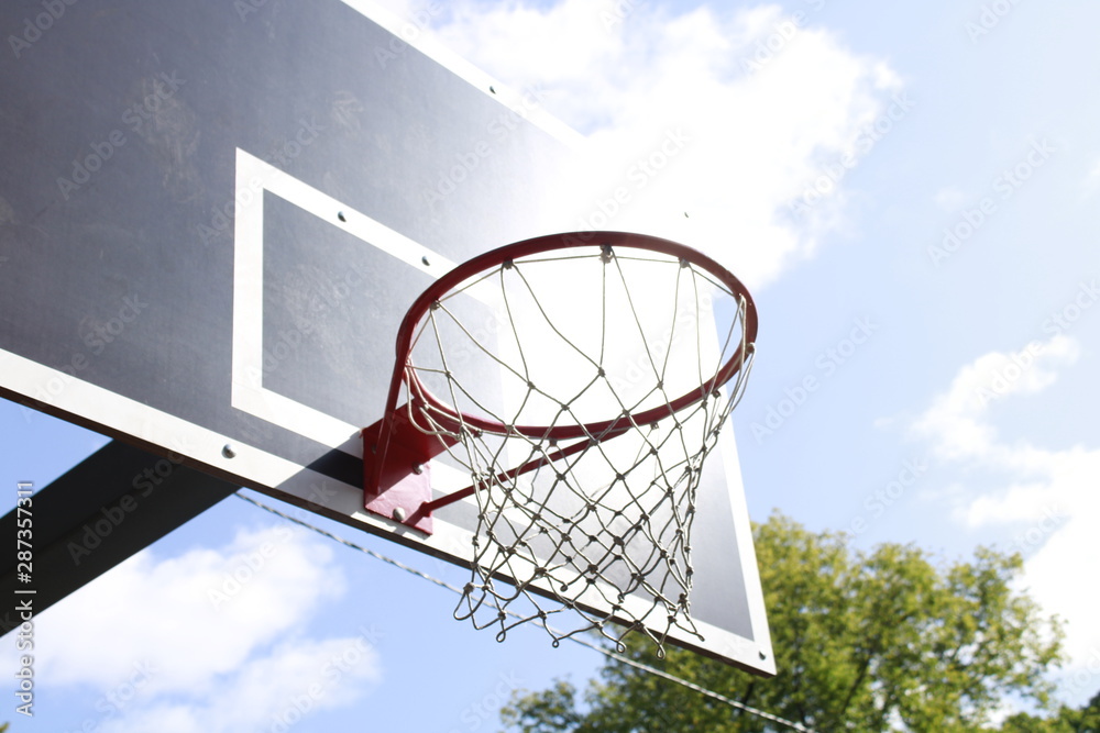 basketball hoop on background of blue sky